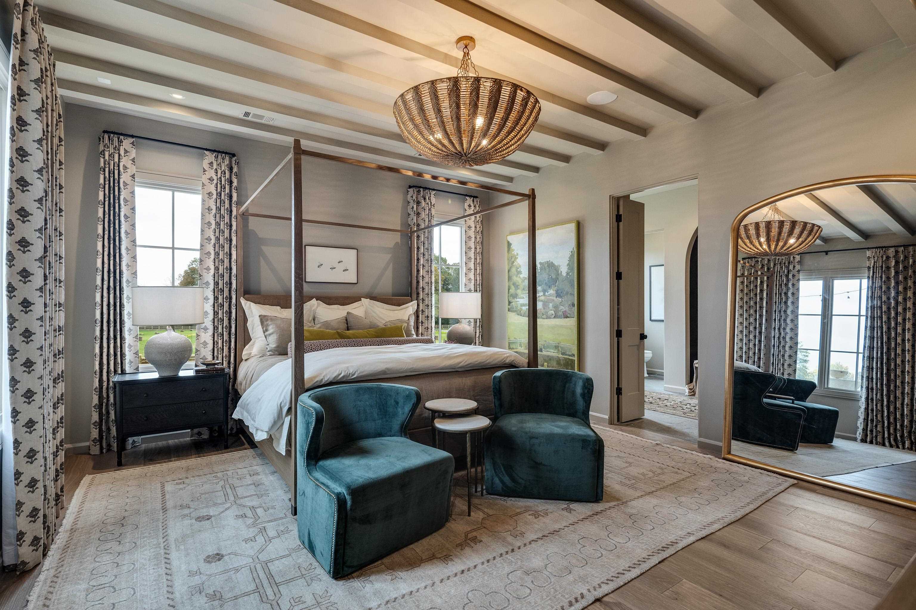 3310 Hidden Creek Loop Collierville, TN 38017 - Photo 17 of 40 a bedroom with a bed a mirror and a balcony