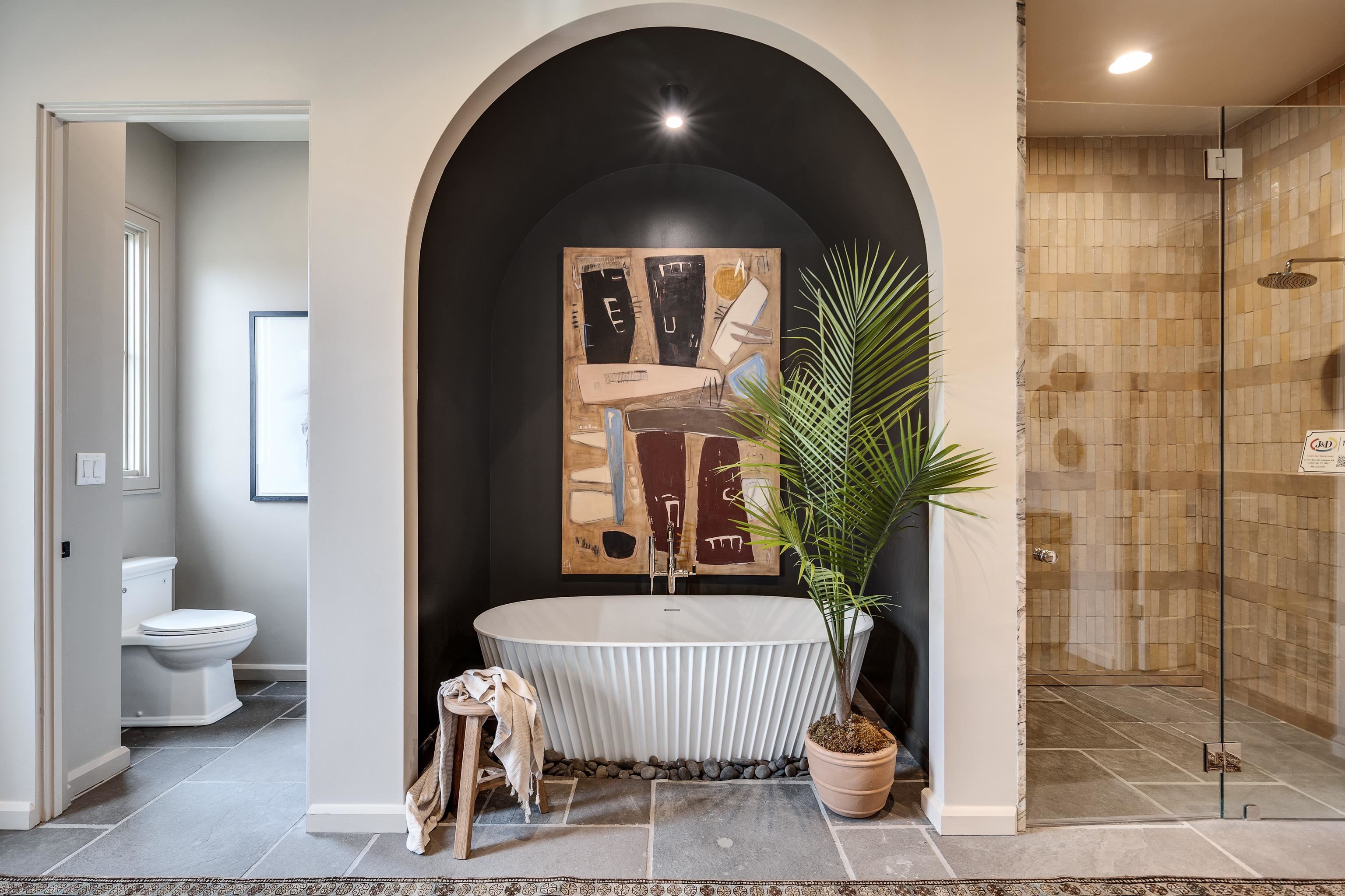 3310 Hidden Creek Loop Collierville, TN 38017 - Photo 18 of 40 a living room with a couch and a potted plant
