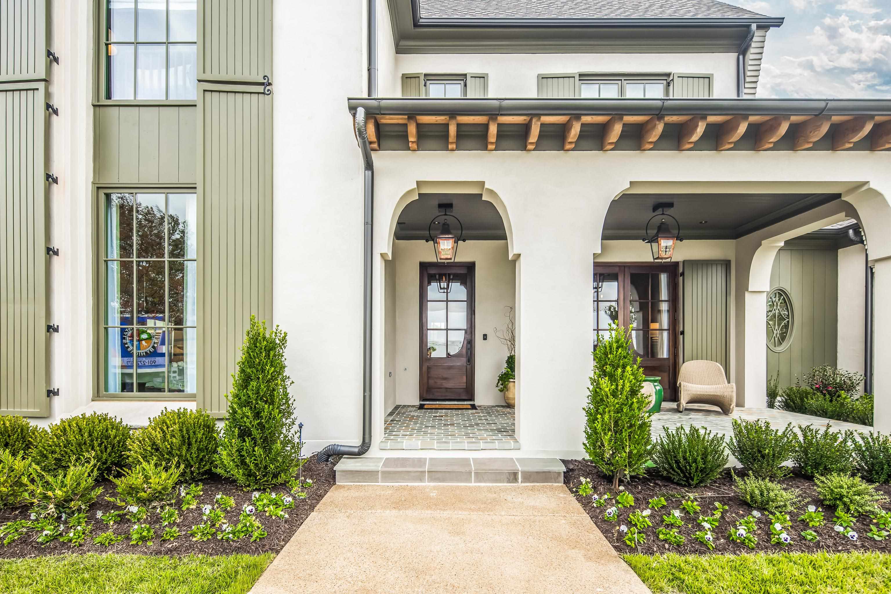 3310 Hidden Creek Loop Collierville, TN 38017 - Photo 2 of 40 Entrance to property featuring a porch and stucco siding