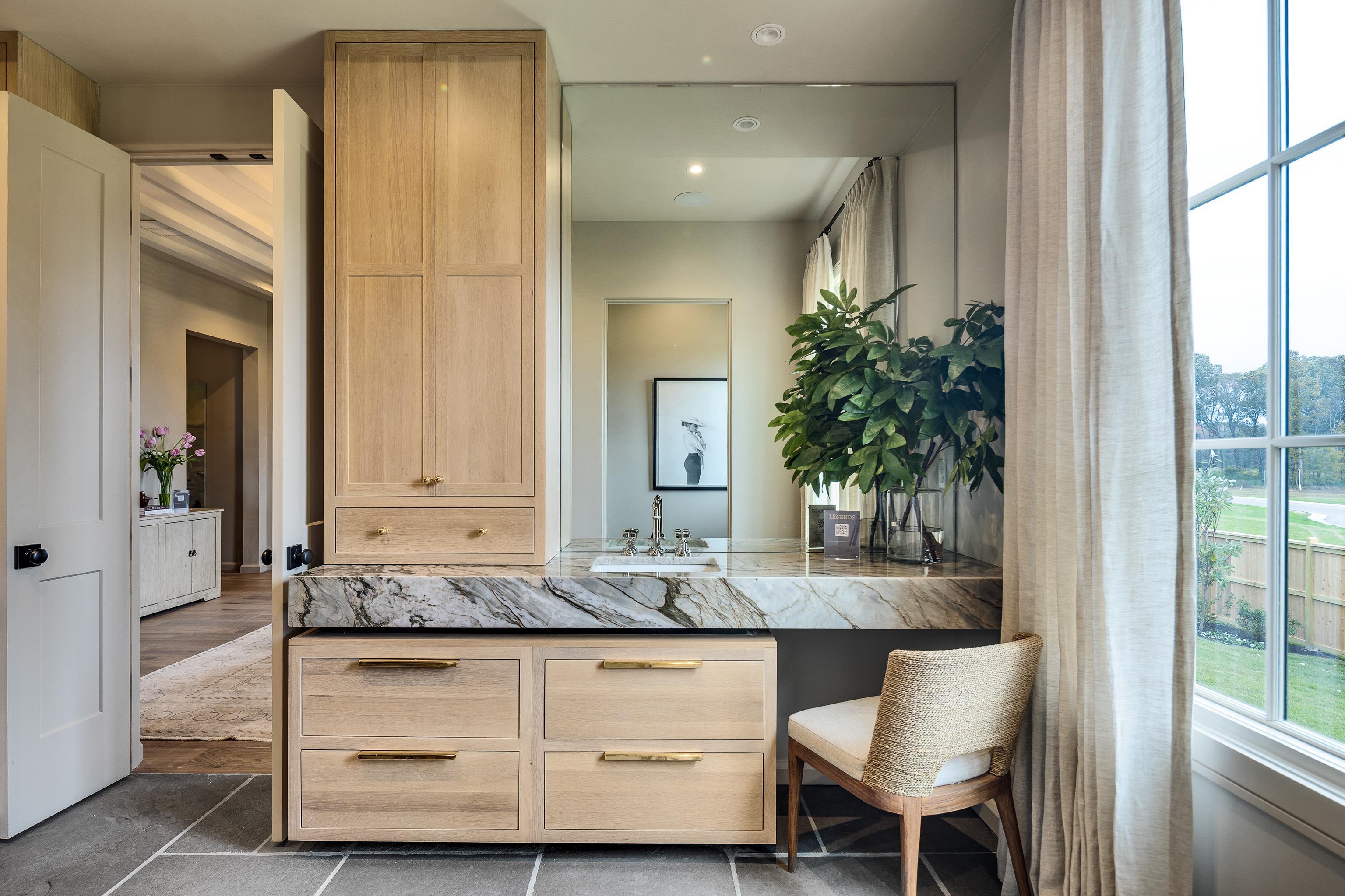 3310 Hidden Creek Loop Collierville, TN 38017 - Photo 20 of 40 a bathroom with sinks a vanity and a mirror