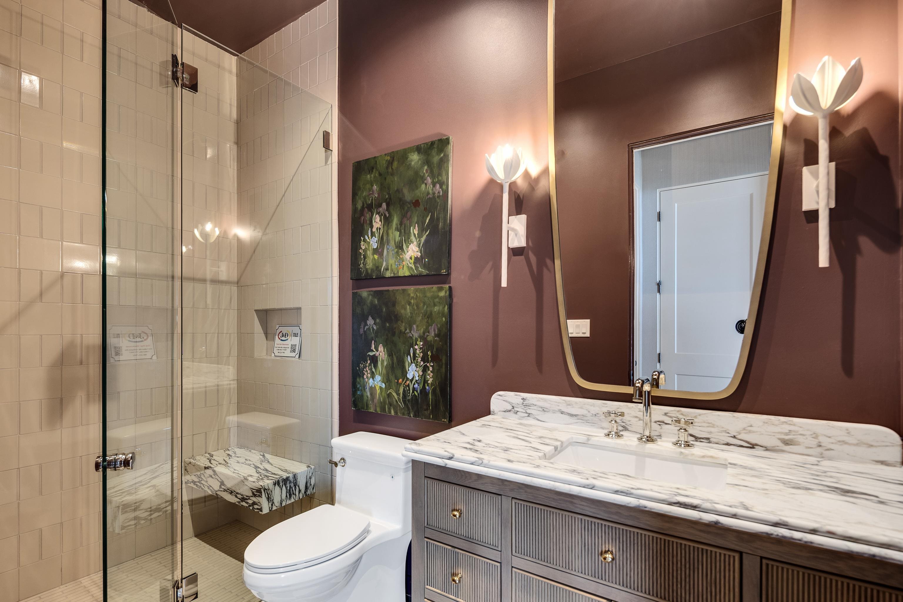 3310 Hidden Creek Loop Collierville, TN 38017 - Photo 23 of 40 a bathroom with a granite countertop sink toilet mirror and shower