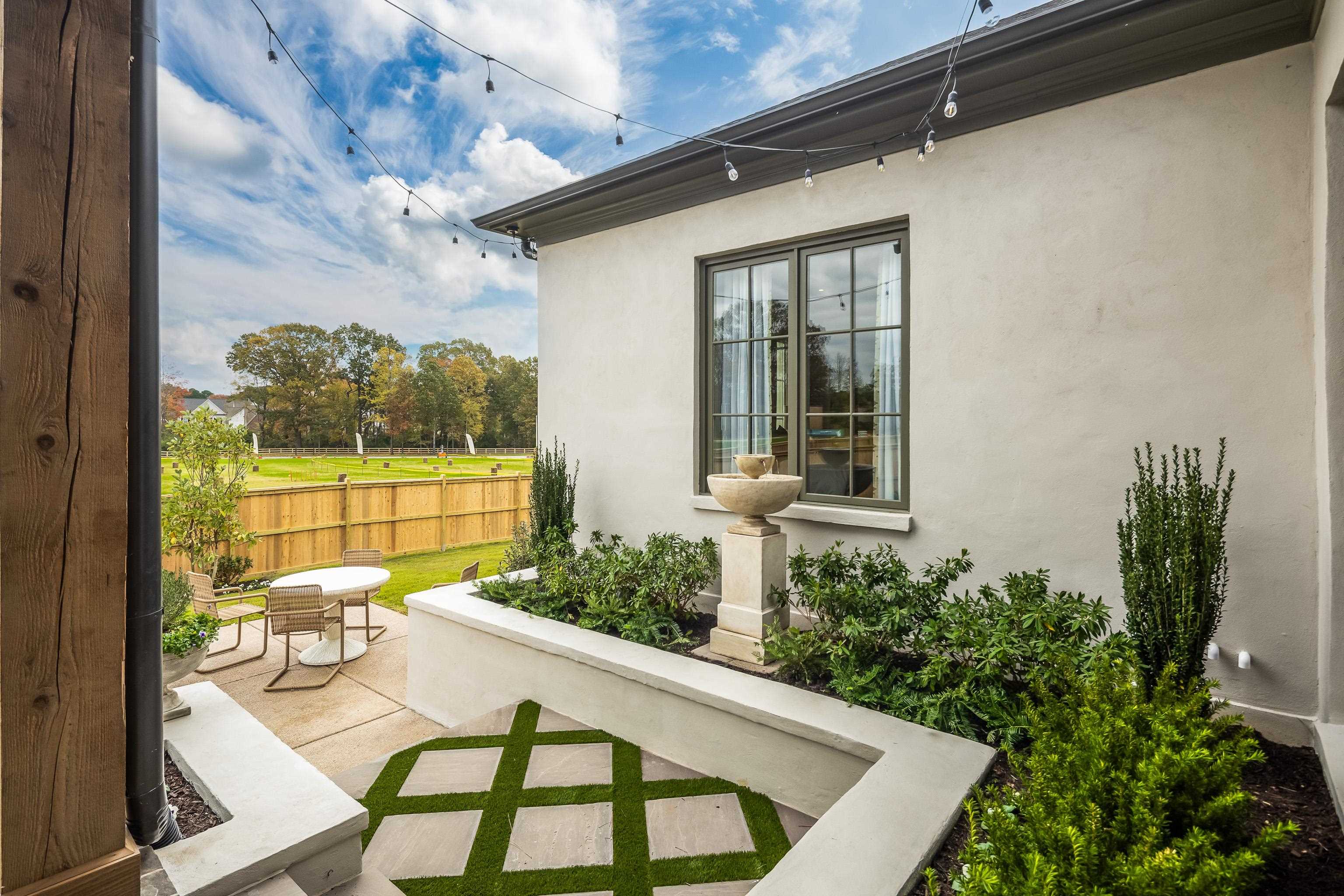 3310 Hidden Creek Loop Collierville, TN 38017 - Photo 36 of 40 View of home's exterior with stucco siding and a patio area