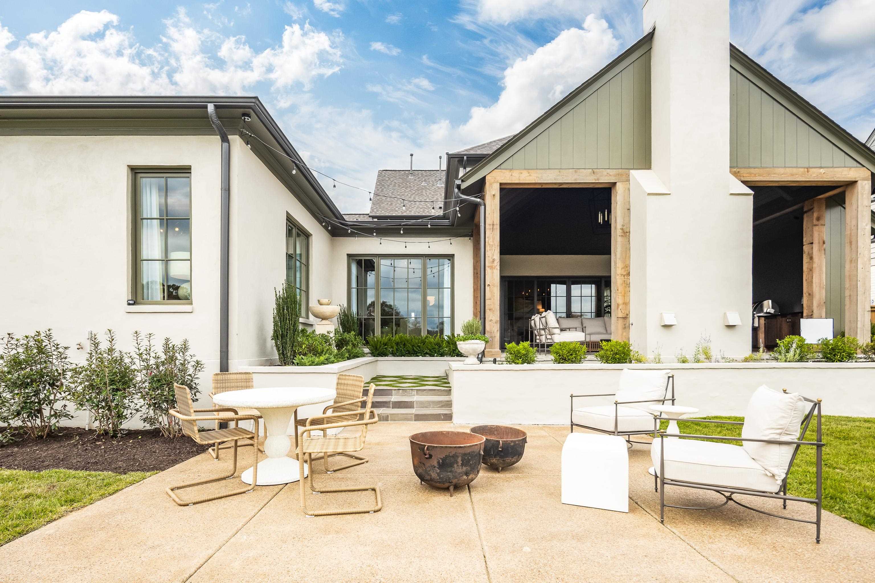 3310 Hidden Creek Loop Collierville, TN 38017 - Photo 38 of 40 a view of a patio with couches table and chairs and potted plants