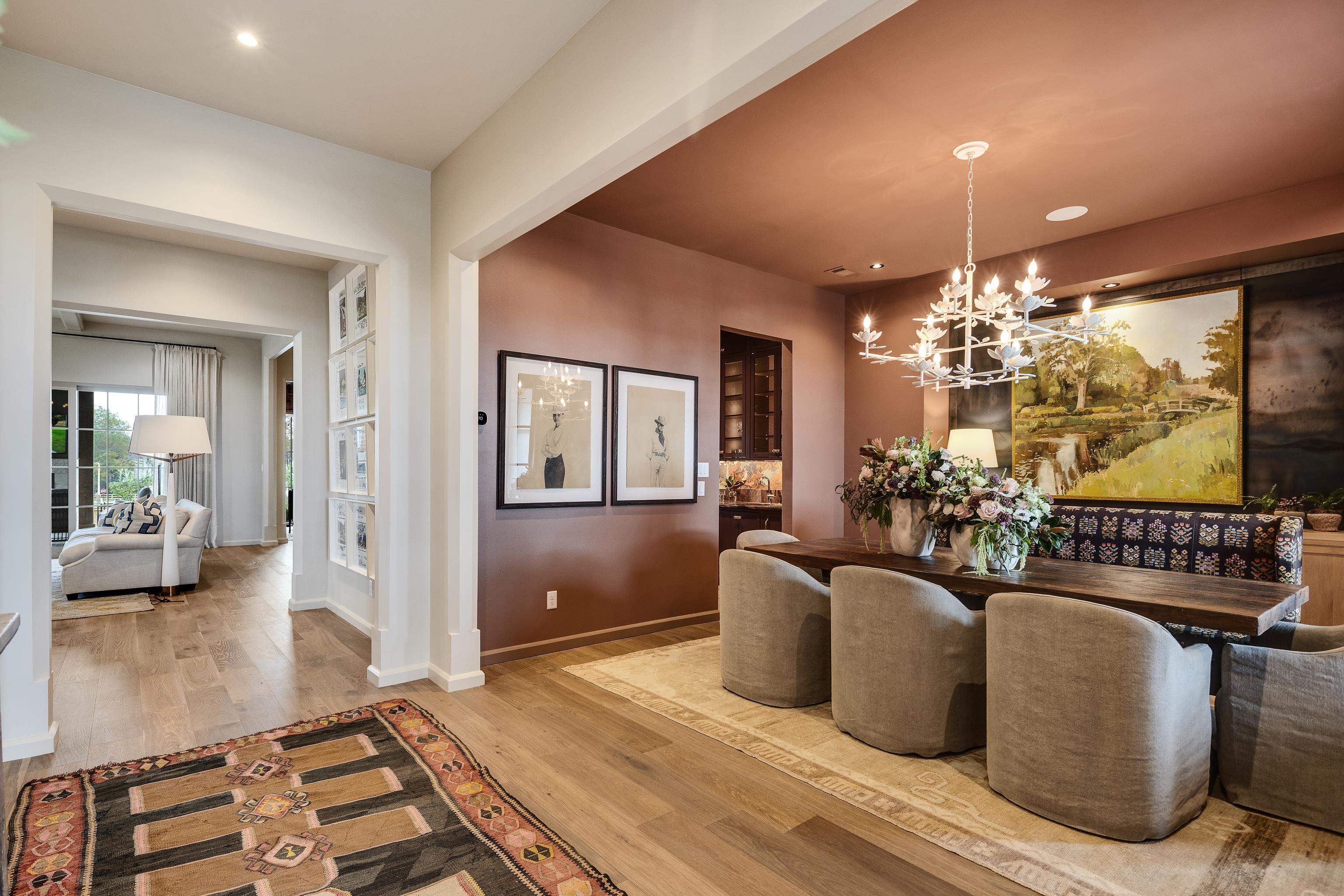 3310 Hidden Creek Loop Collierville, TN 38017 - Photo 4 of 40 a living room with furniture a chandelier and a dining room