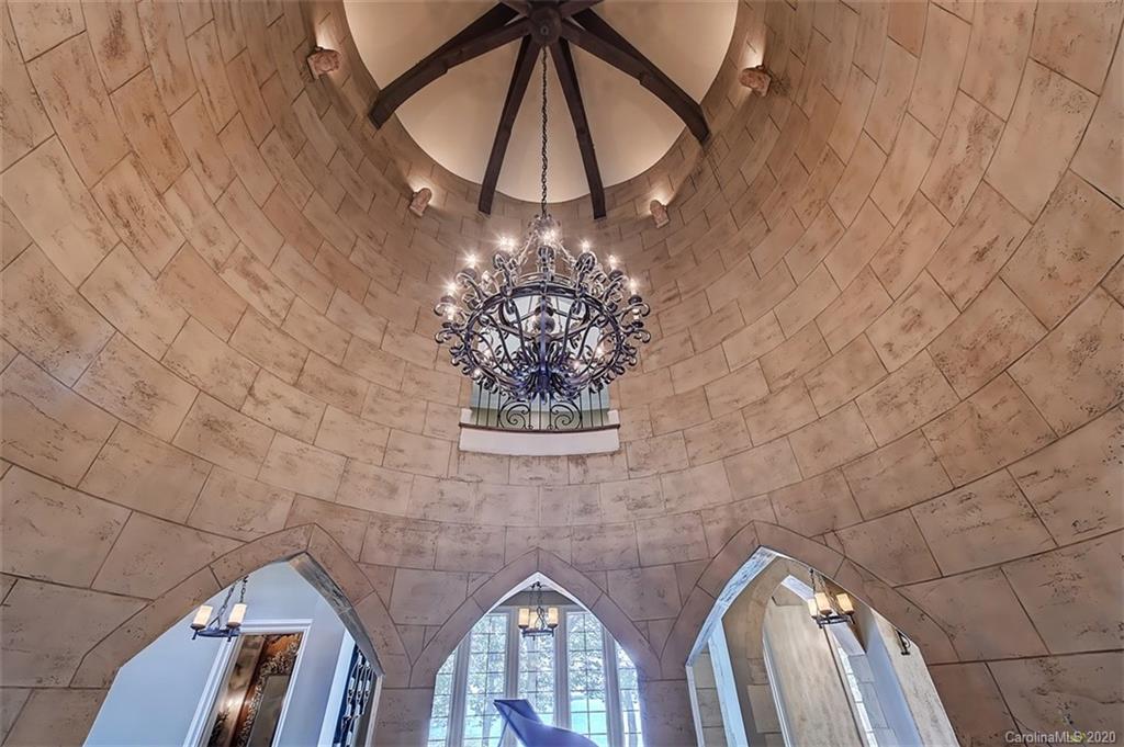 16505 Jetton Road Cornelius, NC 28031 - Photo 11 of 48 a view of a chandelier fan and wooden floor