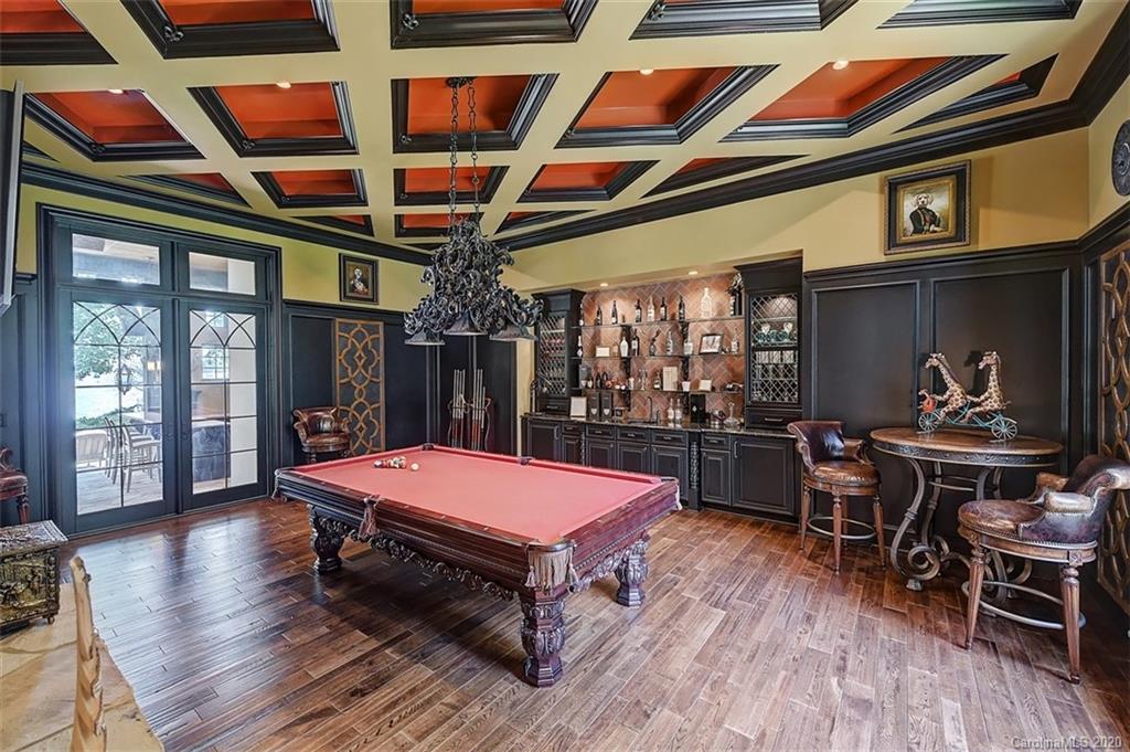 16505 Jetton Road Cornelius, NC 28031 - Photo 22 of 48 a living room with stainless steel appliances dining table wooden floor and a large window