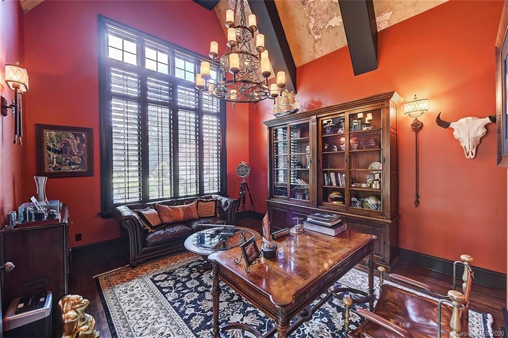 16505 Jetton Road Cornelius, NC 28031 - Photo 24 of 48 a living room with furniture a rug and a chandelier