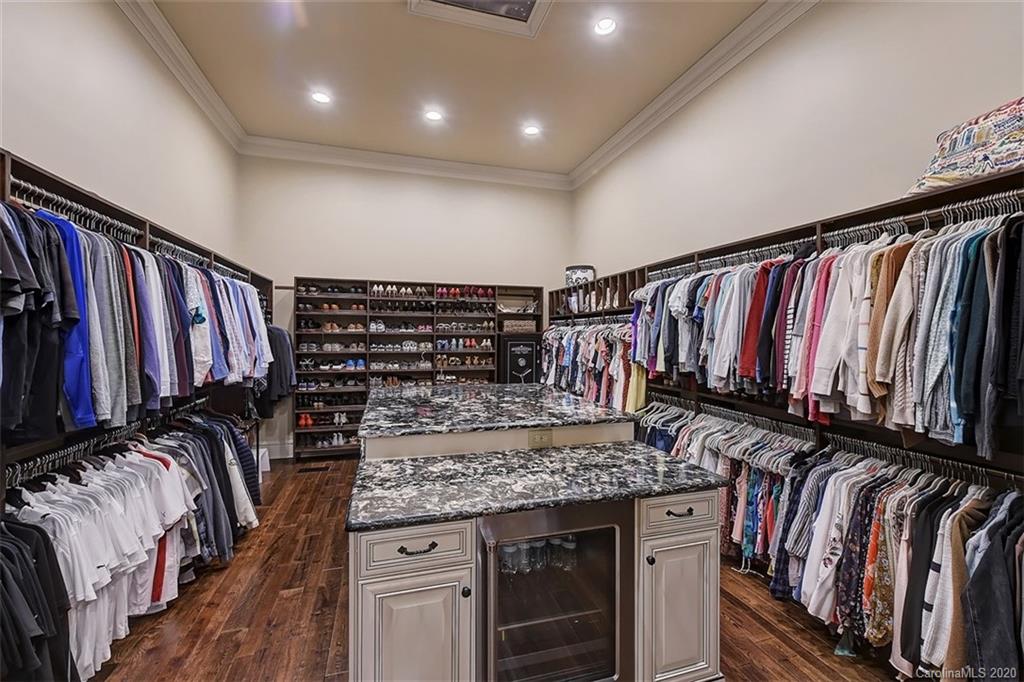 16505 Jetton Road Cornelius, NC 28031 - Photo 30 of 48 a view of walk in closet with clothes and shoes