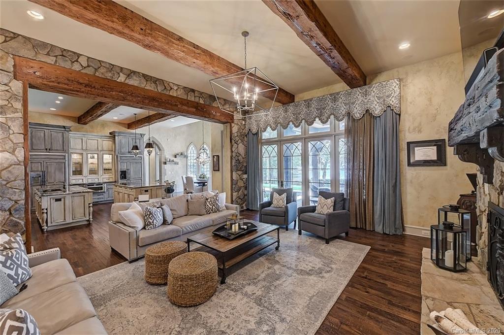 16505 Jetton Road Cornelius, NC 28031 - Photo 4 of 48 a living room with furniture and a chandelier