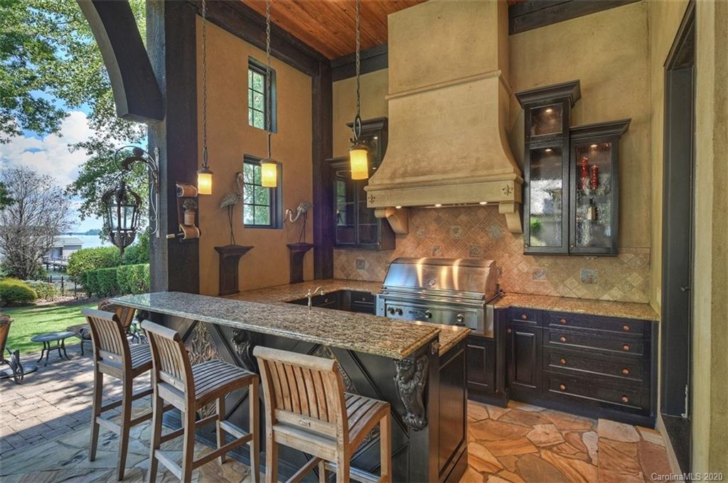 16505 Jetton Road Cornelius, NC 28031 - Photo 35 of 48 a view of a dinning table and chairs in the patio
