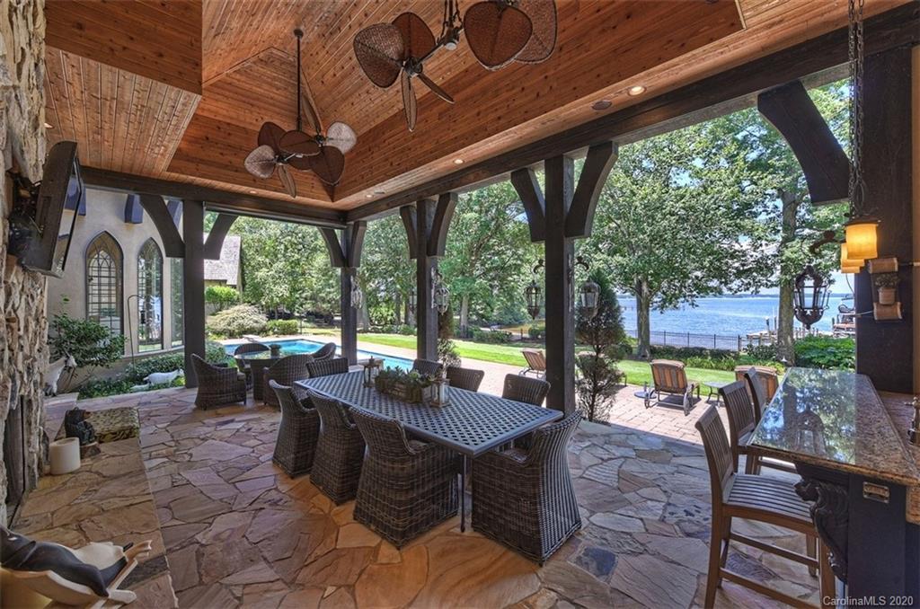 16505 Jetton Road Cornelius, NC 28031 - Photo 36 of 48 a view of a patio with a table chairs and a backyard