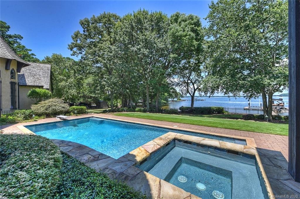 16505 Jetton Road Cornelius, NC 28031 - Photo 37 of 48 a view of swimming pool with lawn chairs and large trees