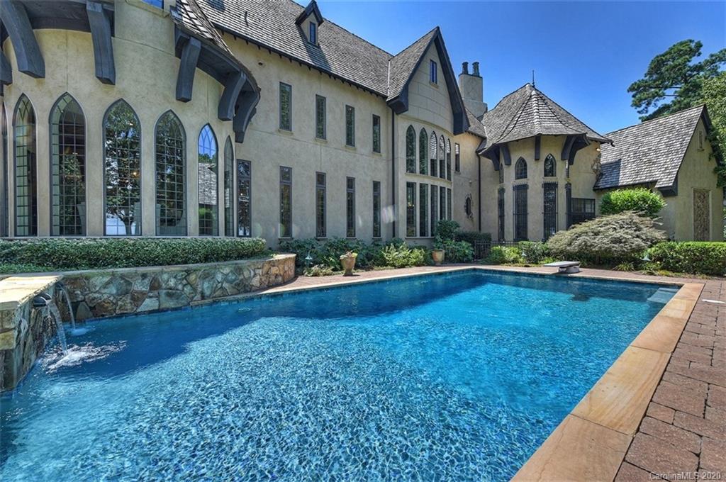 16505 Jetton Road Cornelius, NC 28031 - Photo 38 of 48 a front view of a house with swimming pool and porch