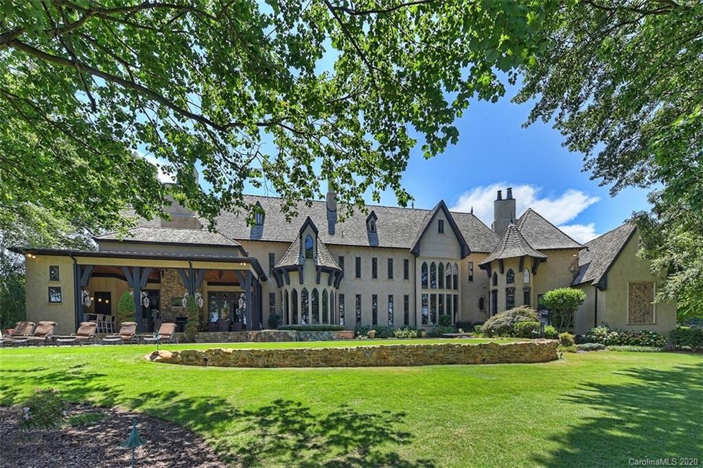 16505 Jetton Road Cornelius, NC 28031 - Photo 41 of 48 a front view of a house with a garden and porch