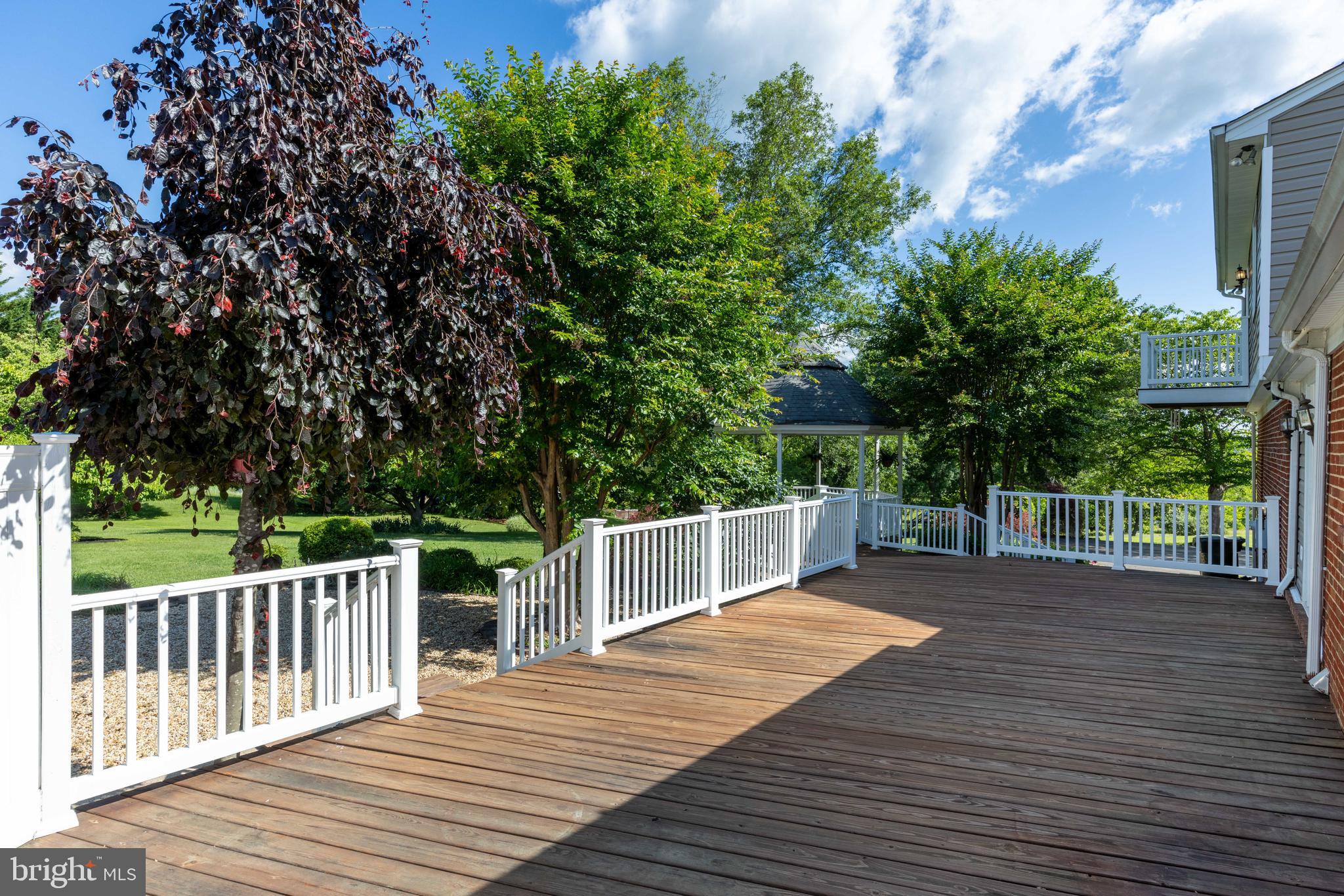 650 Yowell Drive Culpeper, VA 22701 - Photo 11 of 65 a view of a deck with chairs and wooden fence
