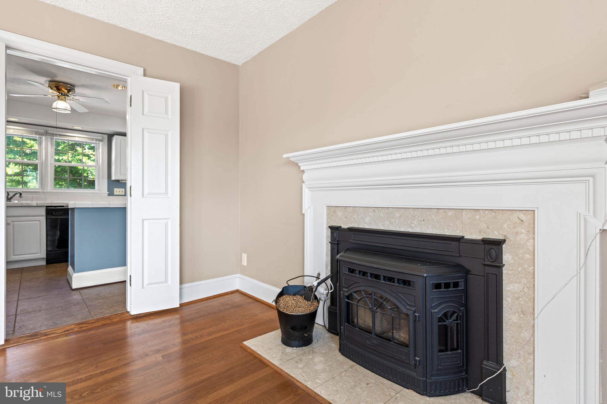 650 Yowell Drive Culpeper, VA 22701 - Photo 20 of 65 a living room with a fireplace and wooden floor