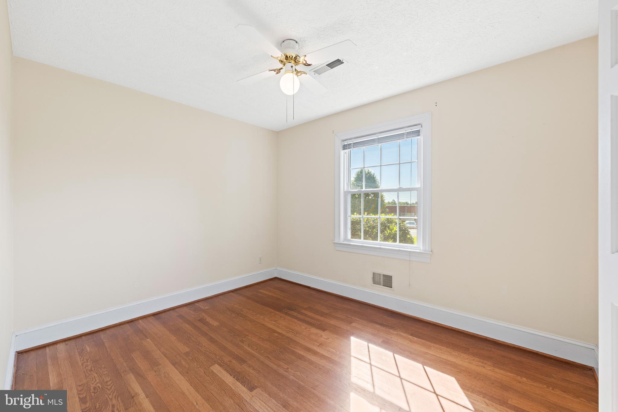 650 Yowell Drive Culpeper, VA 22701 - Photo 34 of 65 an empty room with a window and a ceiling fan