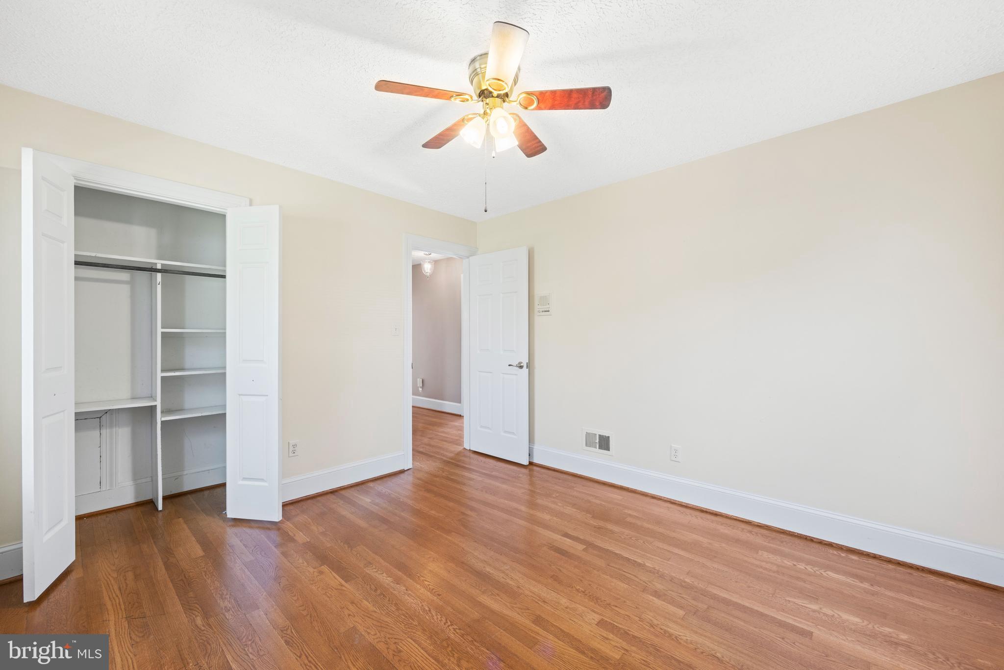 650 Yowell Drive Culpeper, VA 22701 - Photo 37 of 65 an empty room with wooden floor closet and windows