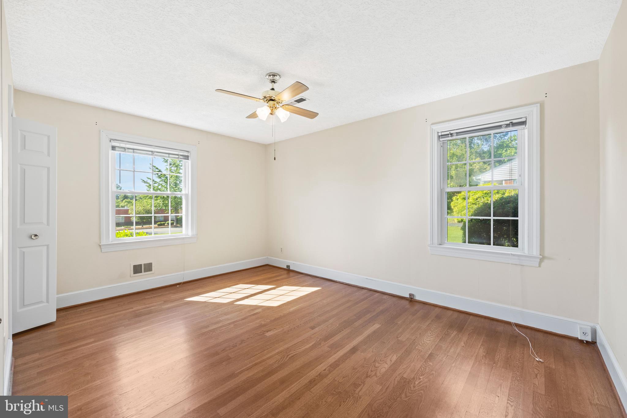 650 Yowell Drive Culpeper, VA 22701 - Photo 38 of 65 a view of an empty room with a window and wooden floor