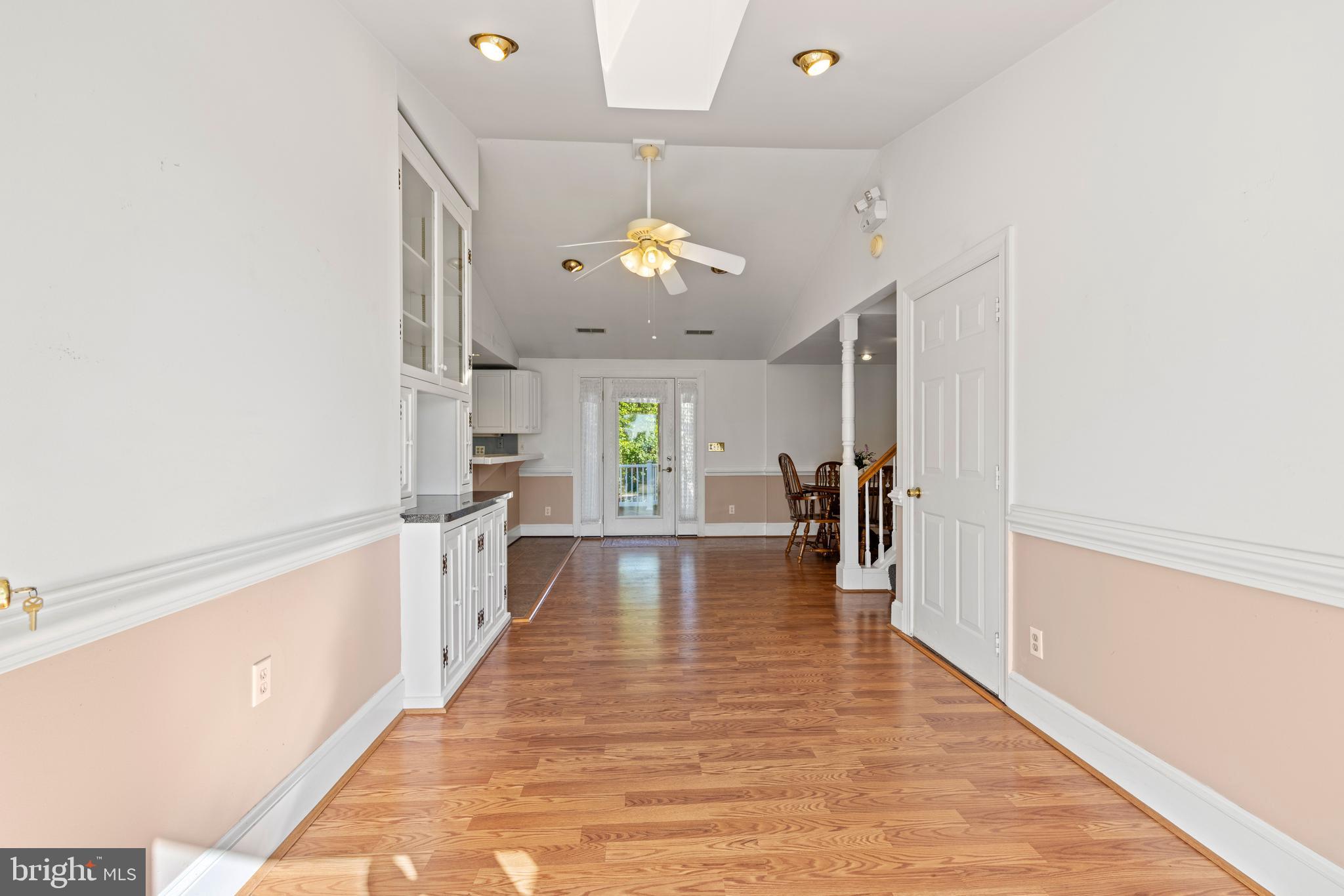650 Yowell Drive Culpeper, VA 22701 - Photo 5 of 65 a view of a hallway with wooden floor