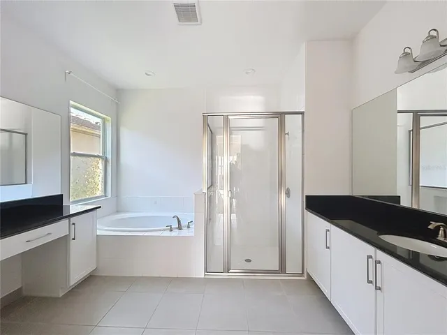 a bathroom with a bathtub and a sink