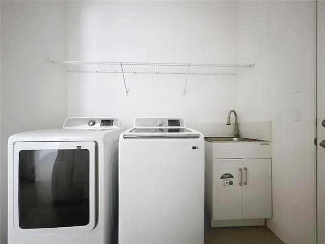 a utility room with dryer and washer