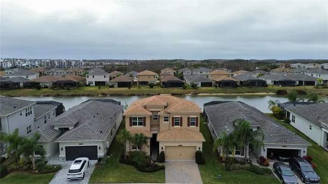 an aerial view of a house with a garden