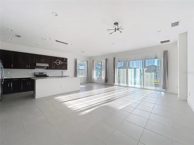 a large white bed in a white room