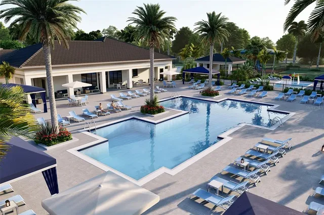 a view of a white building with a swimming pool