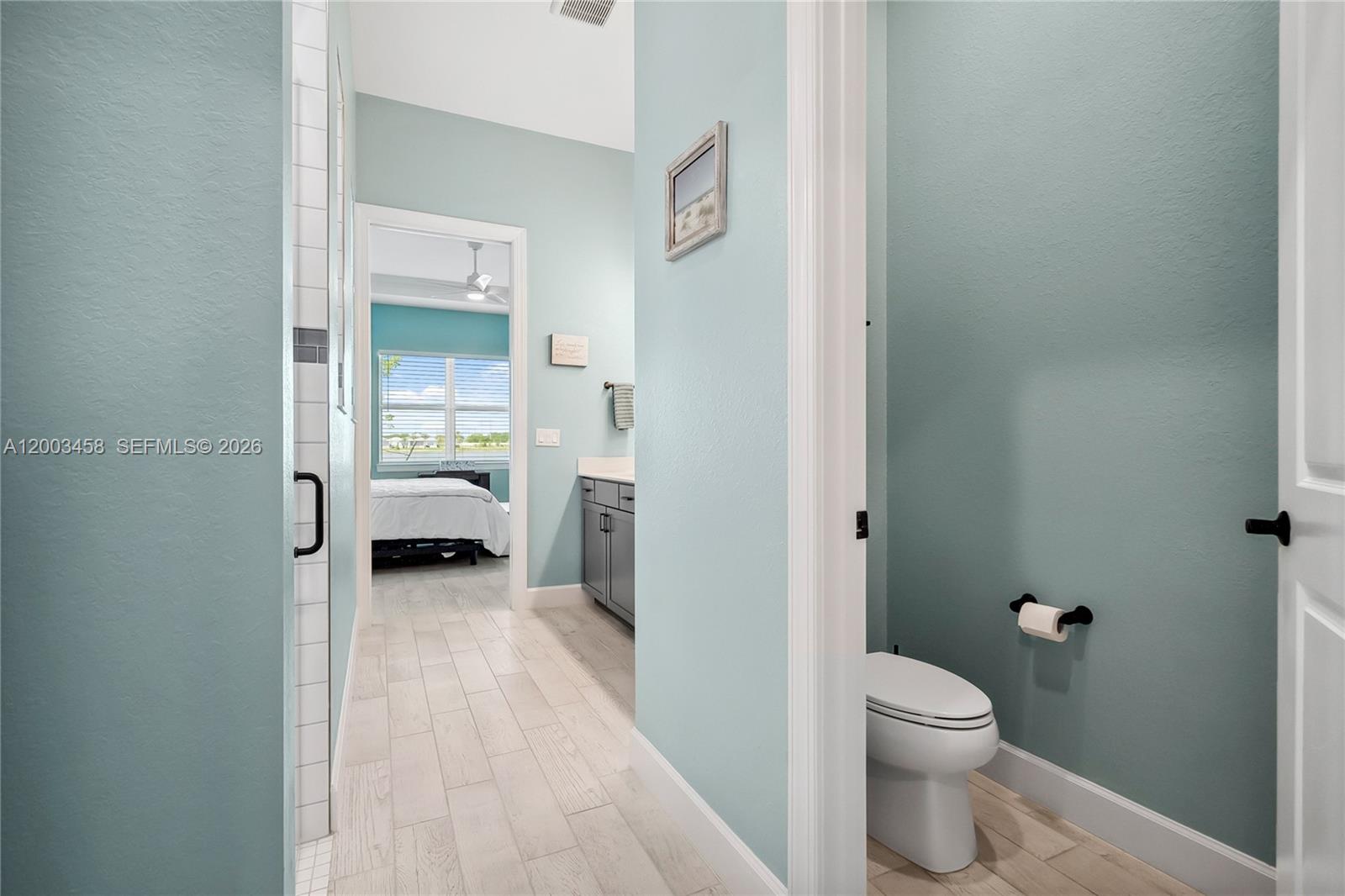9734 Southwest Meridian Way Stuart, FL 34997 - Photo 22 of 48 a en suite bathroom with a toilet