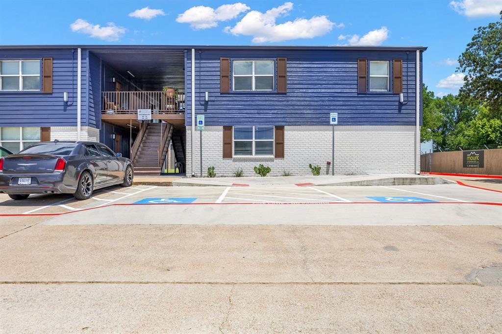 4639 Williams Road, Unit 205 Benbrook, TX 76116 - Photo 10 of 11 View of property with uncovered parking and stairs