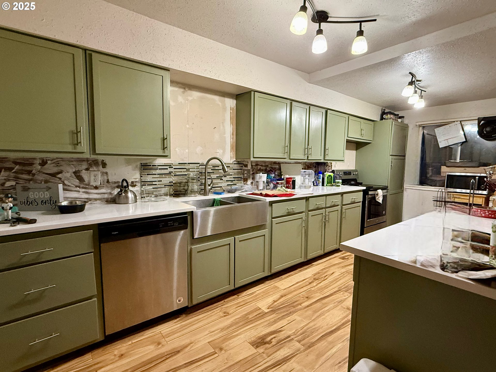 1470 Waite Street Eugene, OR 97402 - Photo 2 of 5 a kitchen with sink a window and chairs