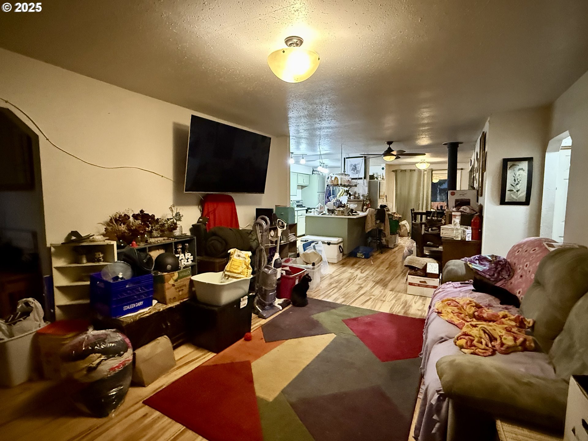 1470 Waite Street Eugene, OR 97402 - Photo 3 of 5 a living room with furniture and a flat screen tv