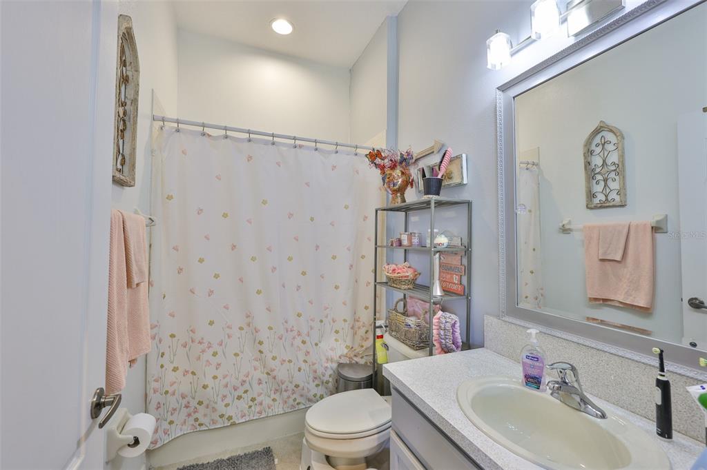 1204 Facet View Way Valrico, FL 33594 - Photo 13 of 59 a bathroom with a sink toilet and shower