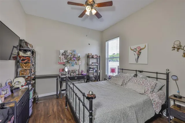 a bedroom with a bed and a table