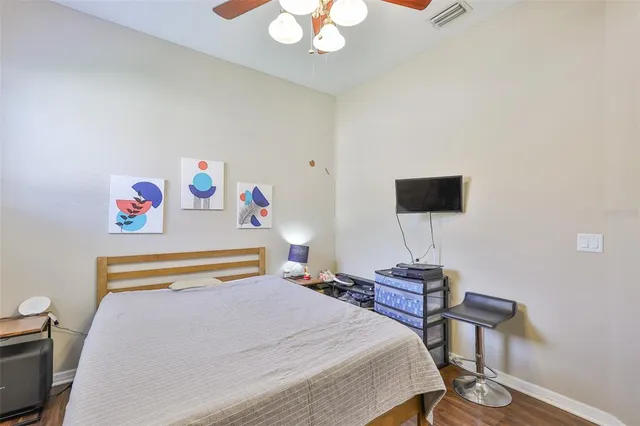a living room with furniture kitchen and a table