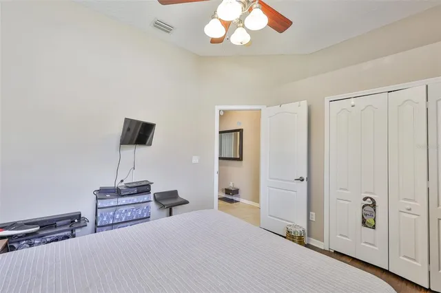 a large kitchen with stainless steel appliances lots of counter space and windows