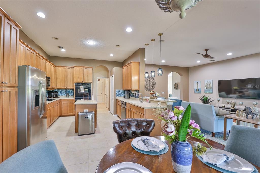1204 Facet View Way Valrico, FL 33594 - Photo 22 of 59 a living room with furniture kitchen and a table