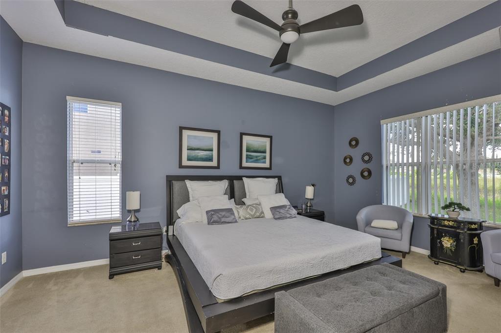 1204 Facet View Way Valrico, FL 33594 - Photo 30 of 59 a bedroom with a bed and wooden floor