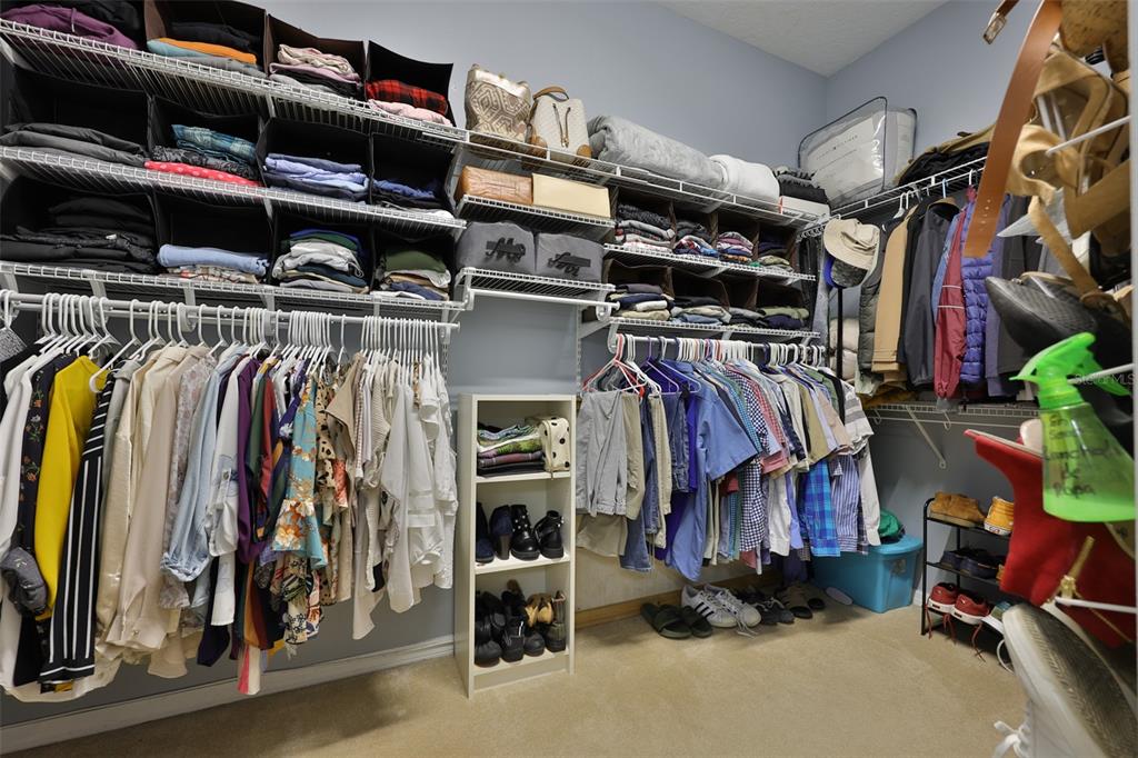 1204 Facet View Way Valrico, FL 33594 - Photo 34 of 59 a view of walk in closet with clothes and shoes