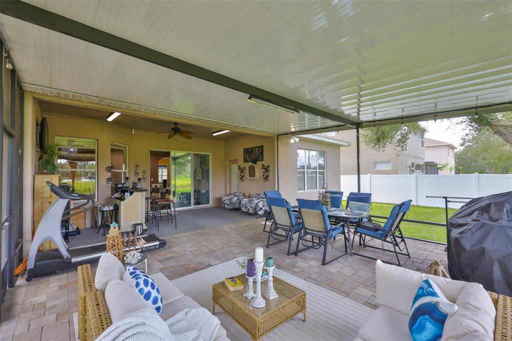 1204 Facet View Way Valrico, FL 33594 - Photo 38 of 59 a living room with furniture a dining table and chairs
