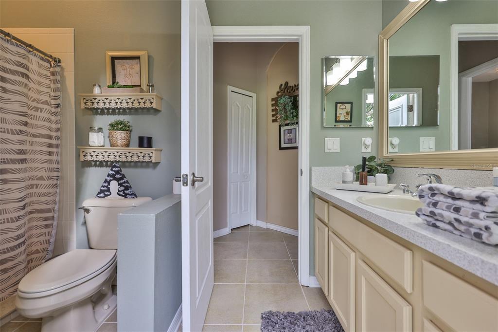 1204 Facet View Way Valrico, FL 33594 - Photo 39 of 59 a bathroom with a sink a toilet and shower