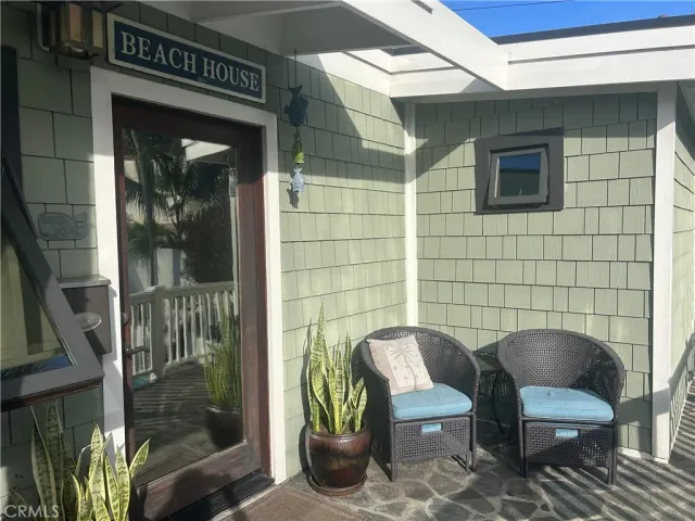 a couple of chairs sitting in front of a door