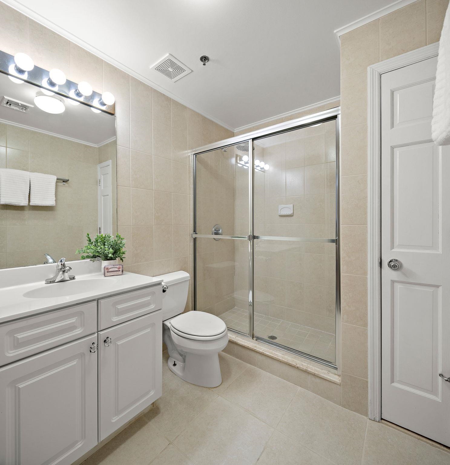 95 Garden Street, Unit 3A Hoboken, NJ 07030 - Photo 18 of 22 a bathroom with a shower sink vanity mirror and toilet