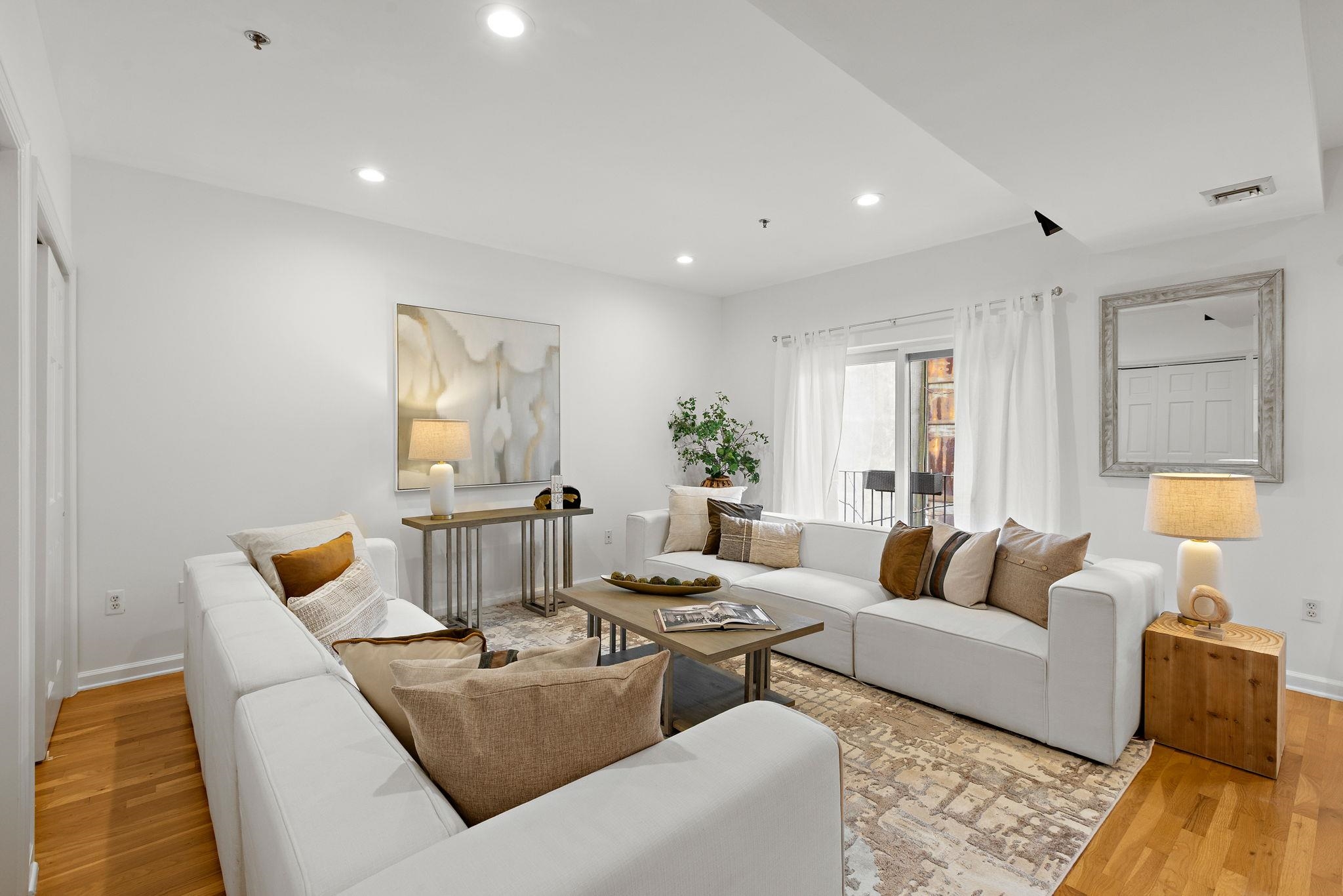 95 Garden Street, Unit 3A Hoboken, NJ 07030 - Photo 2 of 22 a living room with furniture and wooden floor
