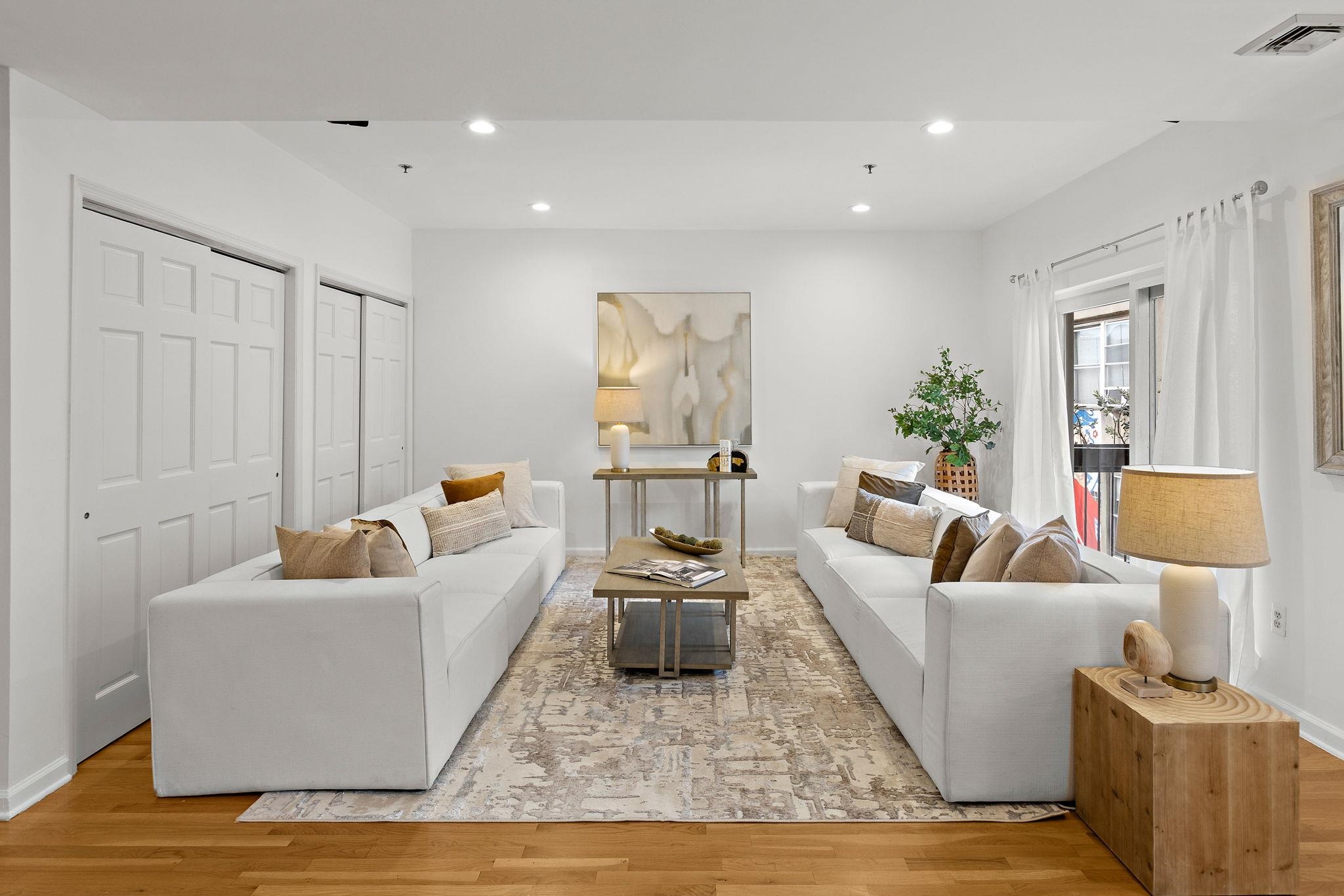 95 Garden Street, Unit 3A Hoboken, NJ 07030 - Photo 4 of 22 a living room with furniture and a couch