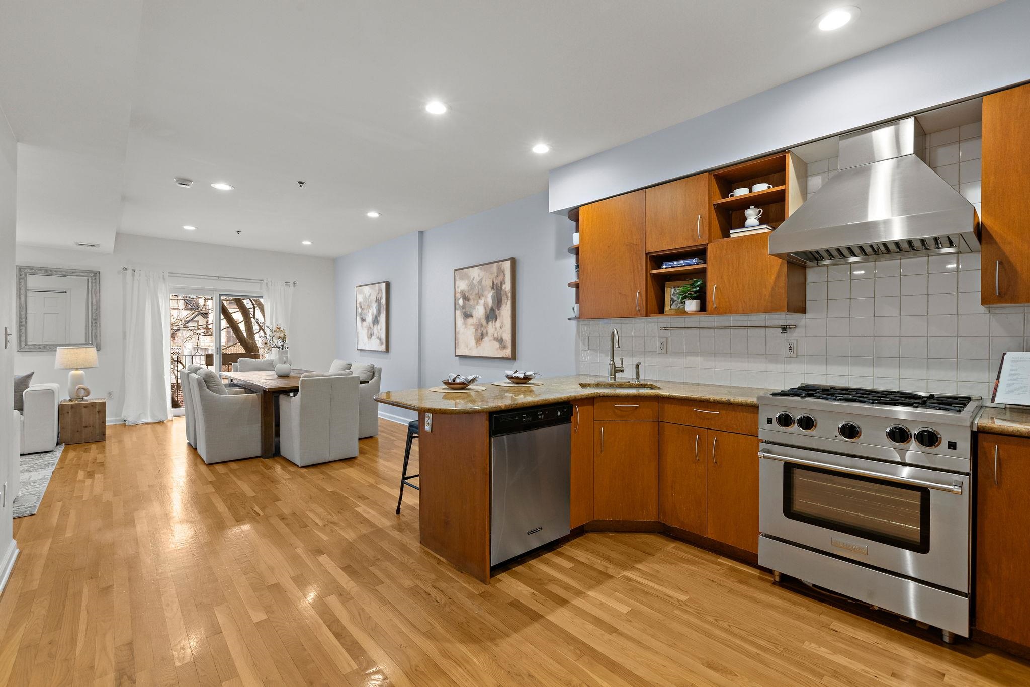 95 Garden Street, Unit 3A Hoboken, NJ 07030 - Photo 10 of 22 a kitchen with stainless steel appliances a stove top oven and sink