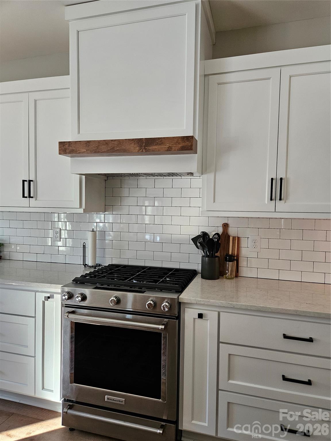6512 Medlin Road Monroe, NC 28112 - Photo 11 of 28 a kitchen with stainless steel appliances granite countertop white cabinets and a stove