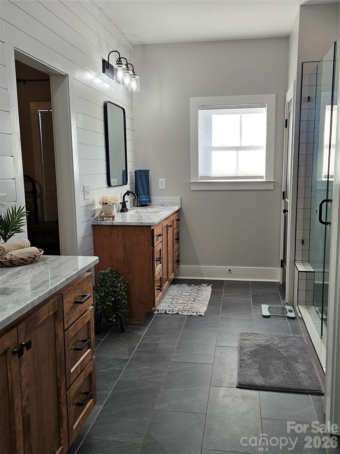 6512 Medlin Road Monroe, NC 28112 - Photo 14 of 28 a bathroom with a sink and a mirror