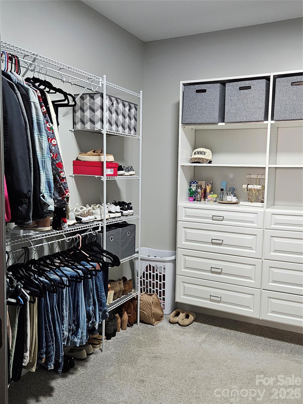 6512 Medlin Road Monroe, NC 28112 - Photo 16 of 28 a view of walk in closet with clothes and shoes